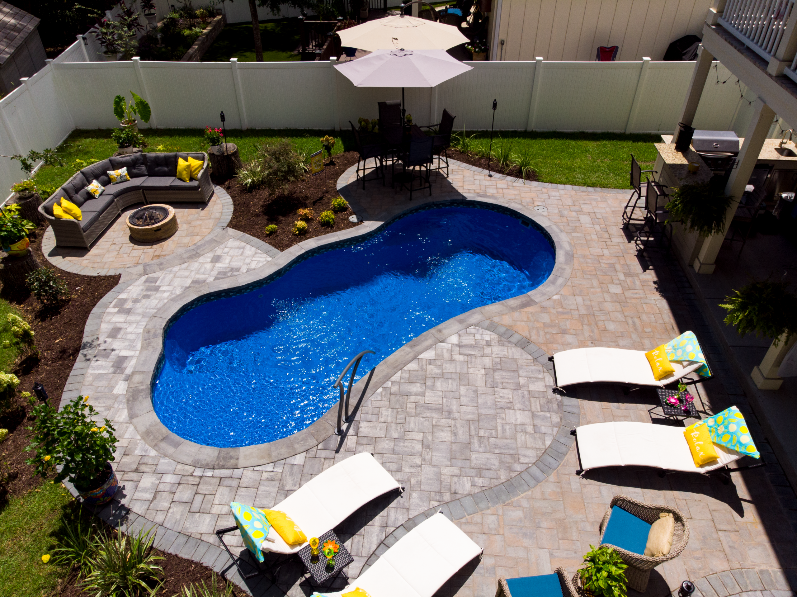 River Pools I25 in Maya Shimmer with concrete paver patio and coping 6