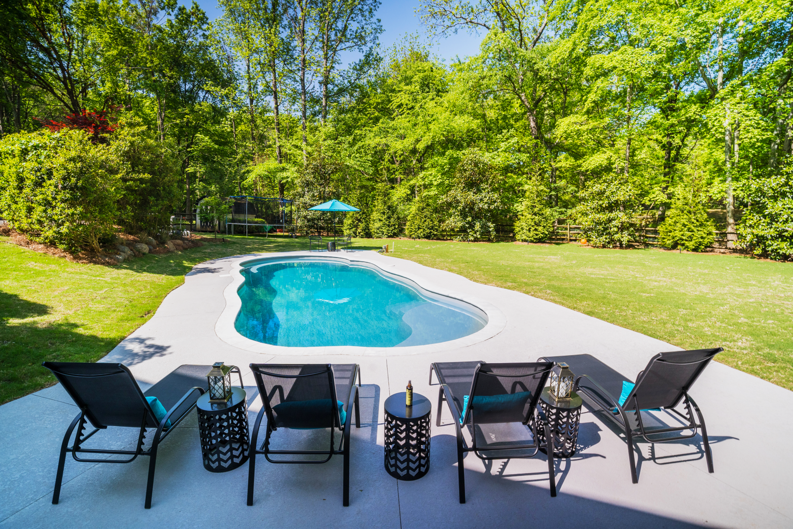 River Pools C40 in Granite Gray with brushed concrete and natural stone coping 7