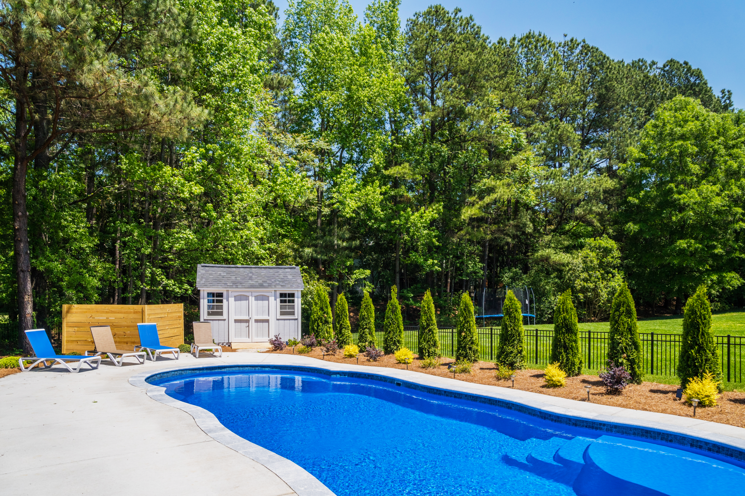 River Pools C40 in Maya Shimmer with brushed concrete and natural stone coping 6