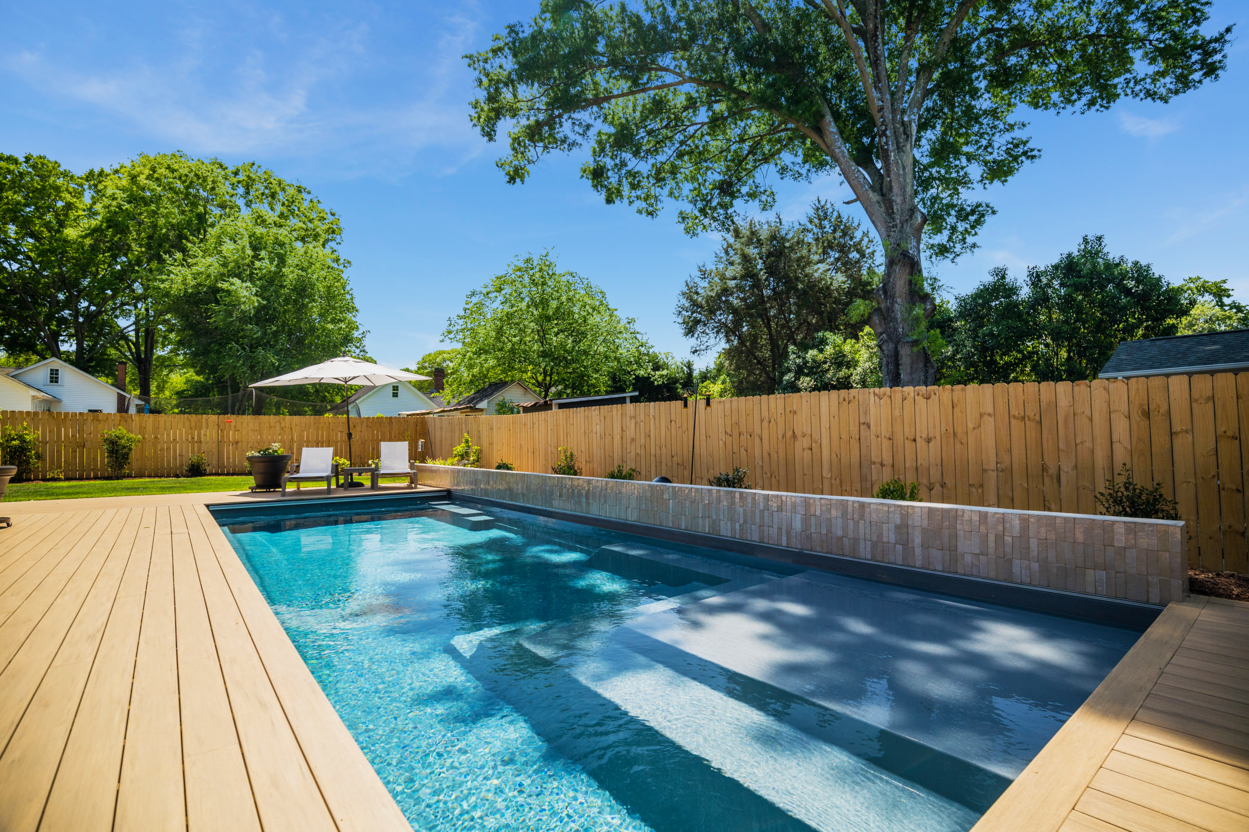 River Pools M35 in Granite Gray with composite wood patio and coping 17